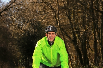 Richard cycling in a wood