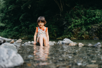 Girl playing in river