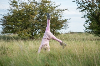 Girl cartwheeling