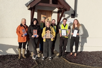 Winncare staff after wildflower seed planting