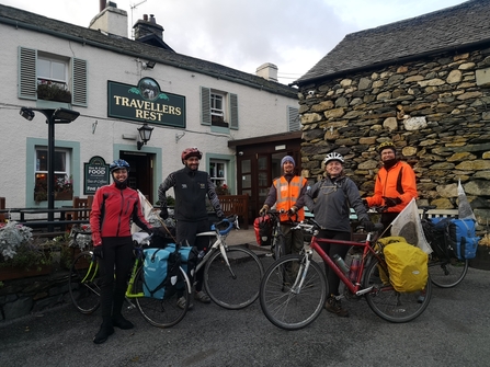 Cycling group outside pub