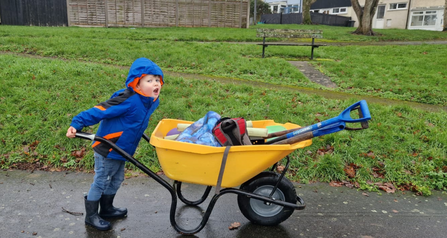 Child with wheel barrow