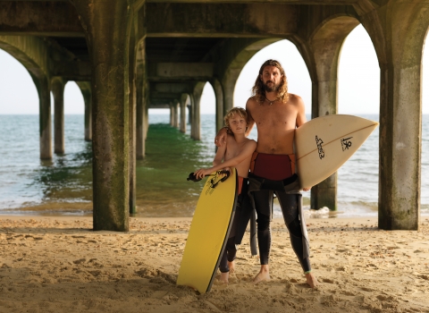 Father and son with surf boards