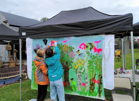 Young people doing graffiti art